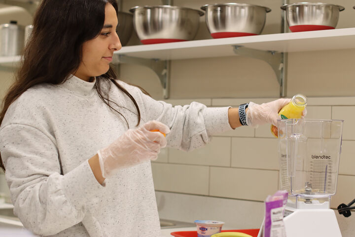 An IU Indianapolis student works in a nutrition and dietetics lab.